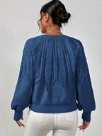 Afslappet kabelstrikket sweater, set forfra