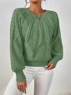 Afslappet kabelstrikket sweater, detalje af strikstruktur