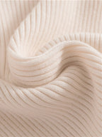 Grøn rullekravesweater, set bagfra