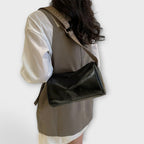 Crossbody taske med vævet skulderrem