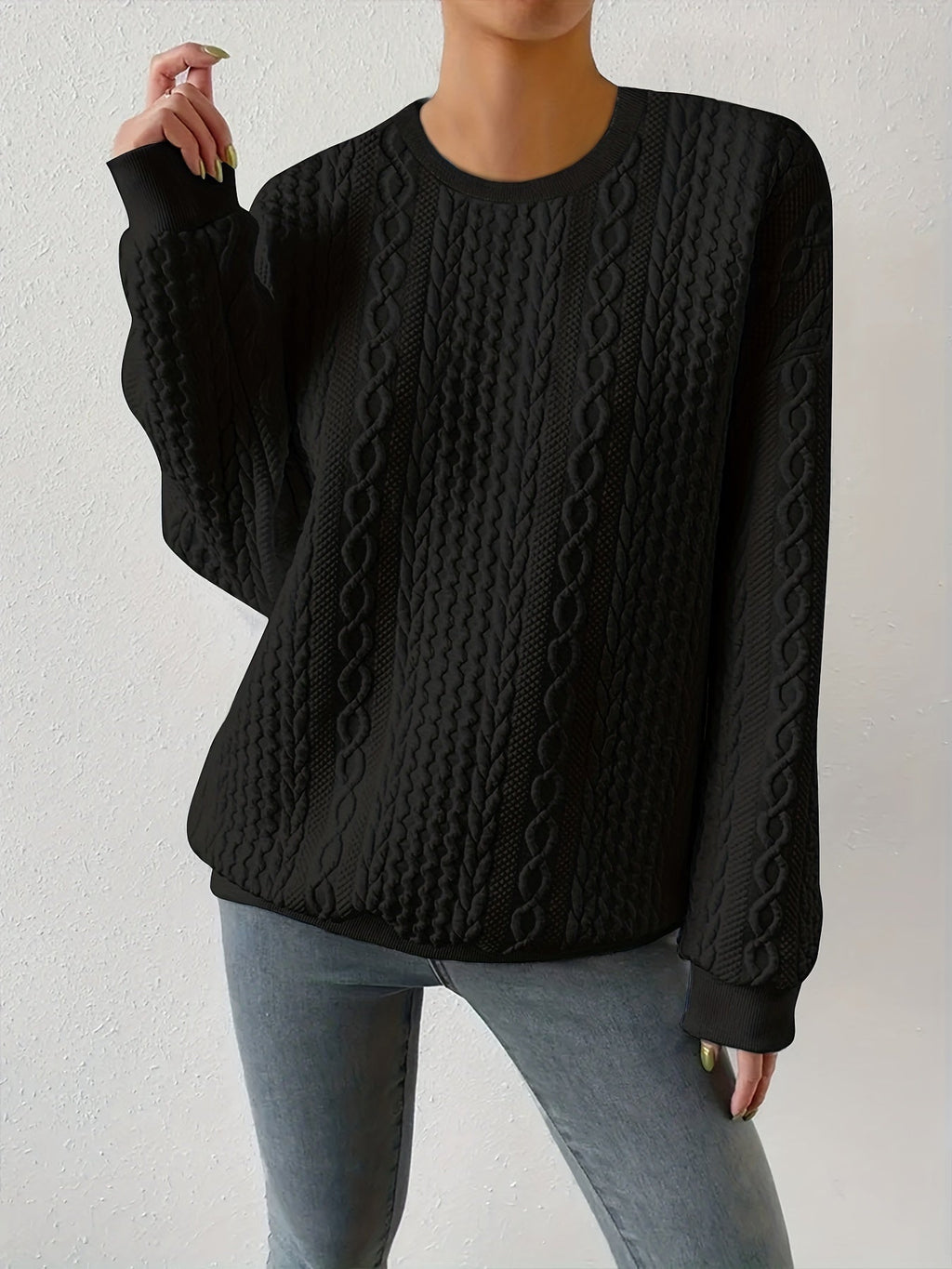 Teksturet kabelstrik-sweatshirt, helfigur foto