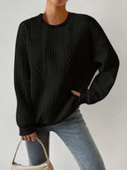 Teksturet kabelstrik-sweatshirt, close-up af ærme