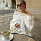 Off-shoulder strikbluse, i sort farve, close-up af strik