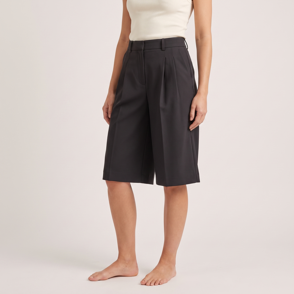 Black high-waisted tailored city shorts, three-quarter view