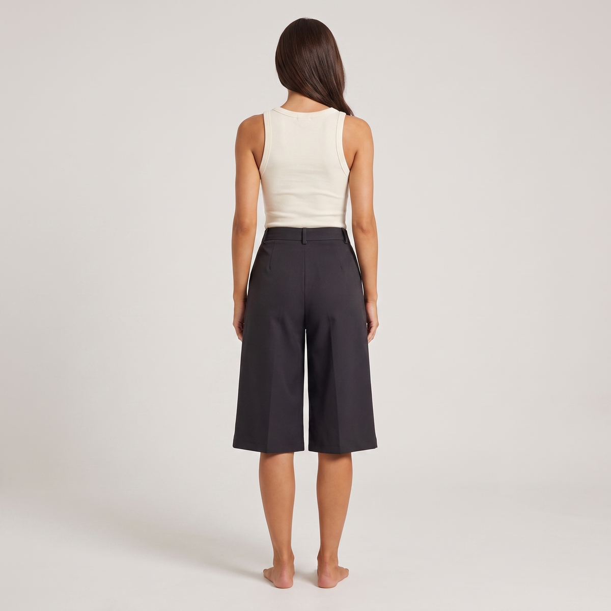 Black high-waisted tailored city shorts, back view
