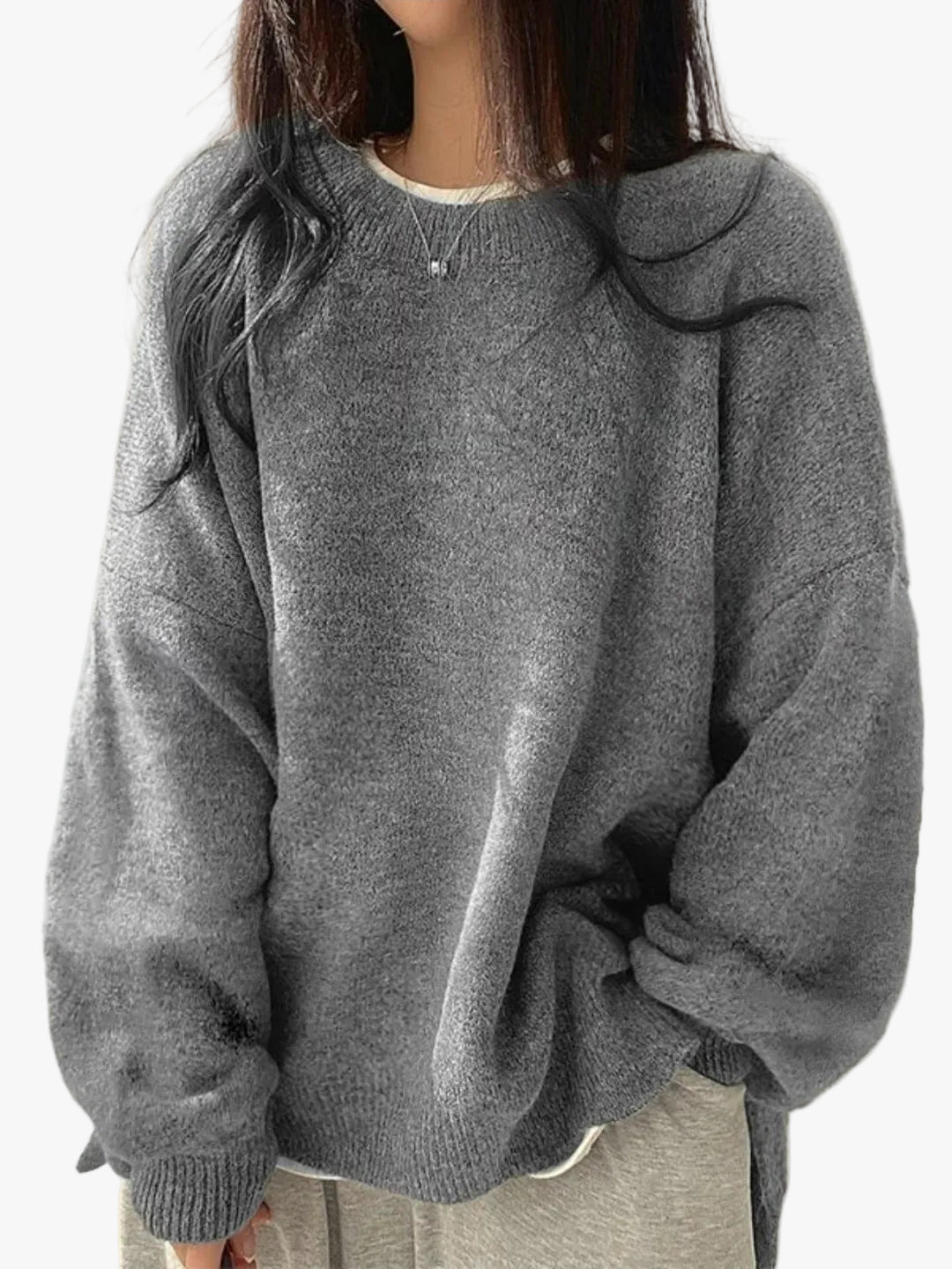 Strik-sweater med faldende skuldre, set forfra